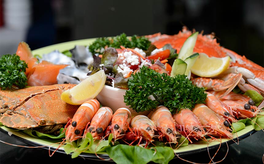 Enjoy a seafood platter overlooking the river.